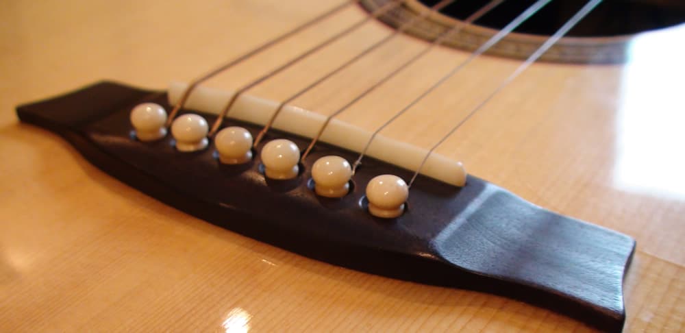 Read more about the article Do Acoustic Guitar Saddles Wear Out?