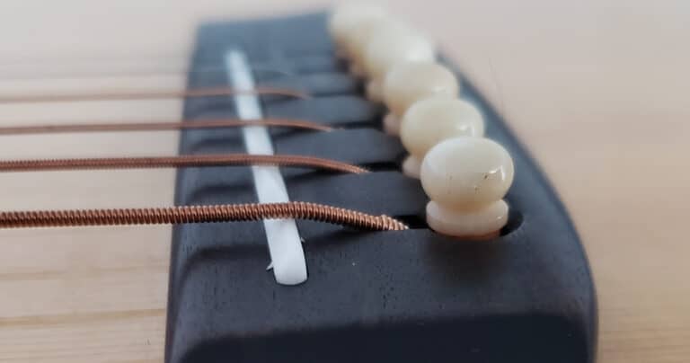 Low break angle guitar saddle
